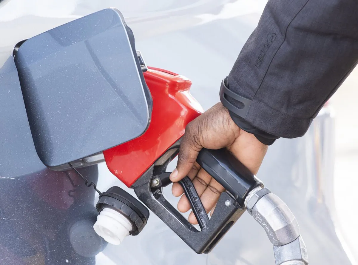 A man pumps gas in Montreal, March 4, 2022. (The Canadian Press/Graham Hughes)