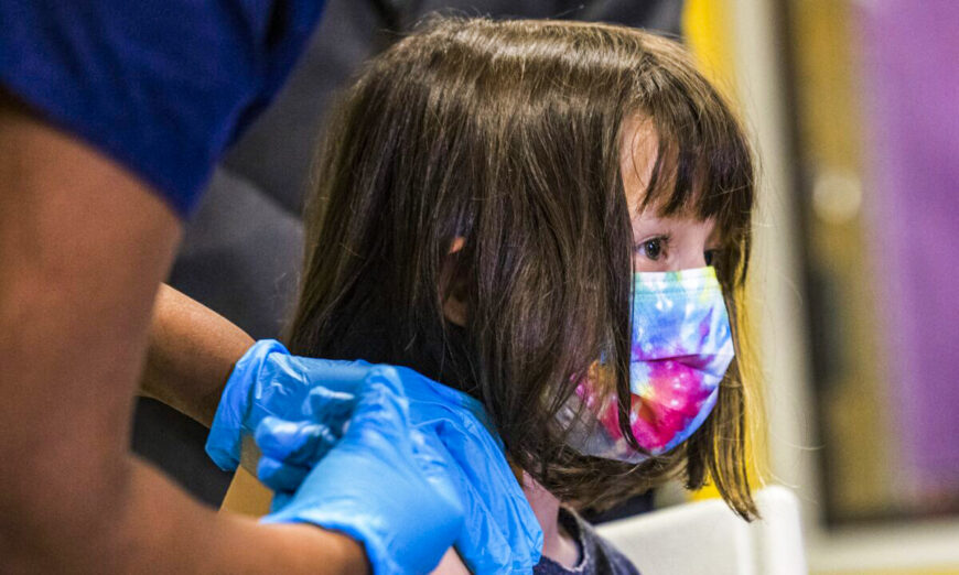 A 5-year-old girl gets a Pfizer COVID-19 vaccine on Nov. 8, 2021. (Michael M. Santiago/Getty Images)