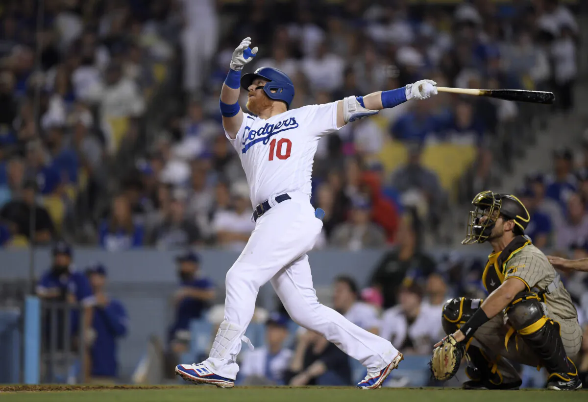 Justin Turner #10 of the Los Angeles Dodgers hits a two-run home run against starting pitcher Joe Musgrove #44 of the San Diego Padres to score Max Muncy #13 during the seventh inning at Dodger Stadium, in Los Angeles, on June 30, 2022. (Kevork Djansezian/Getty Images)