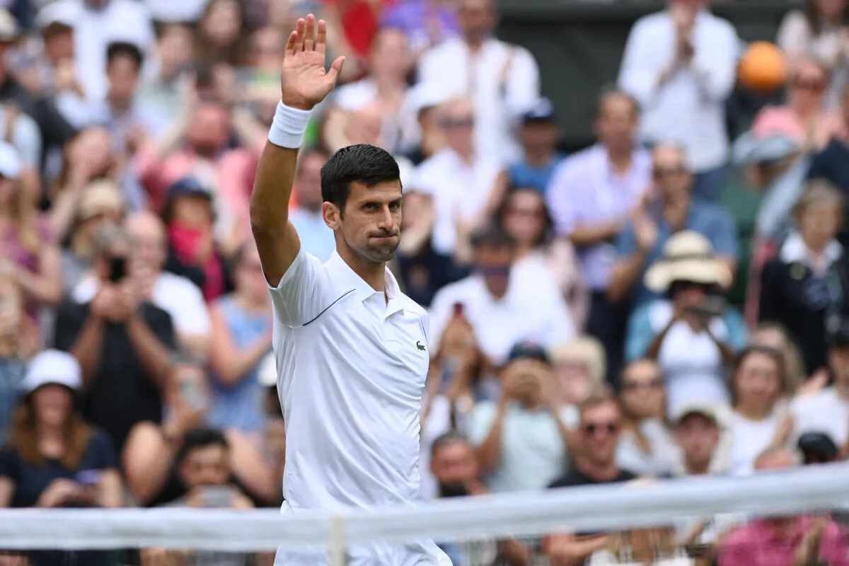 Serbia's Novak Djokovic celebrates beating Serbia's Miomir Kecmanovic during their men's singles tennis match on the fifth day of the 2022 Wimbledon Championships at The All England Tennis Club in Wimbledon, southwest London on July 1, 2022. (Glyn Kirk/AFP via Getty Images)