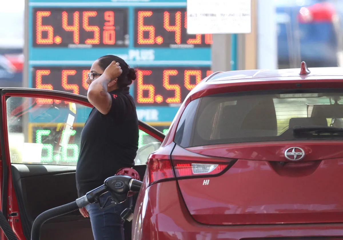 A customer pumps gas into their car at a gas station in Petaluma, Calif., on May 18, 2022.
(Justin Sullivan/Getty Images)