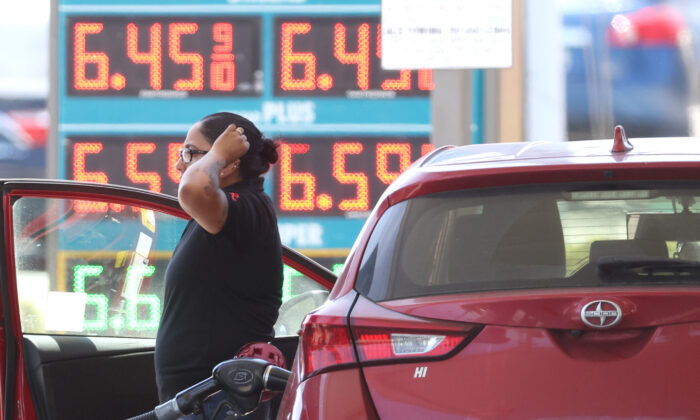 A customer pumps gas into their car at a gas station in Petaluma, Calif., on May 18, 2022.
(Justin Sullivan/Getty Images)