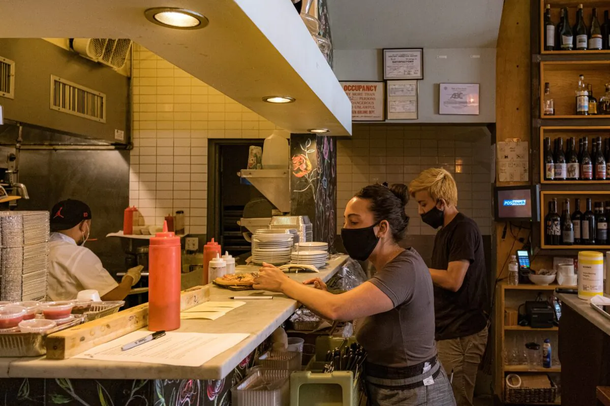 Staff work in a restaurant kitchen in Hoboken, N.J., on June 15, 2020. (Jeenah Moon/Getty Images)