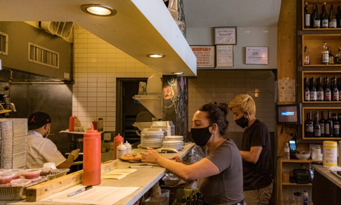 Staff work in a restaurant kitchen in Hoboken, N.J., on June 15, 2020. (Jeenah Moon/Getty Images)