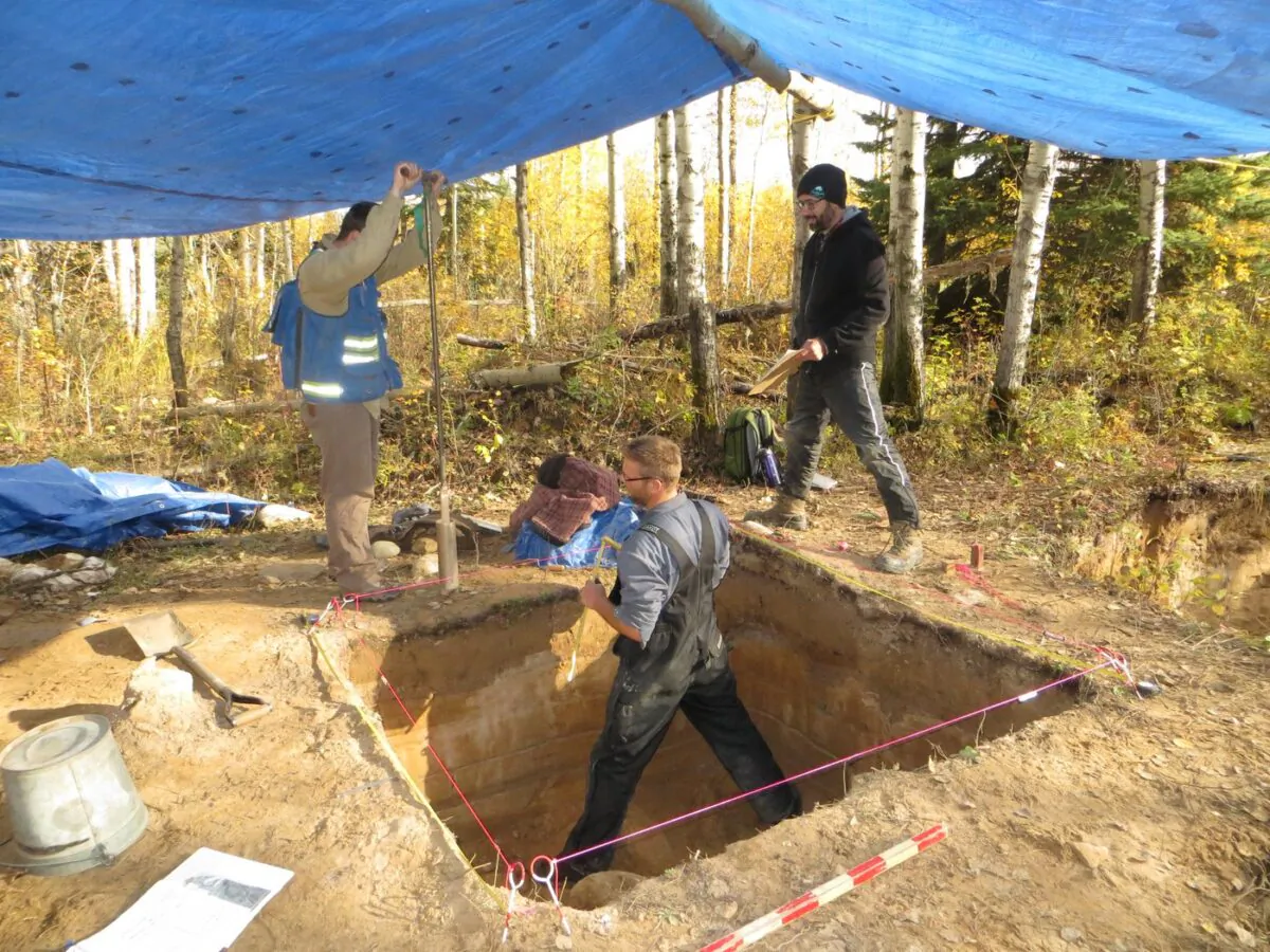 Reid Graham (left to right) of the Manitoba Historic Resources Management Branch, Todd Kristensen of the Archaeological Survey of Alberta and Robin Woywitka of MacEwan University excavate an archeological dig in the Fort McMurray, Alta., area in a handout photo. (The Canadian Press/HO/Brittany Romano)