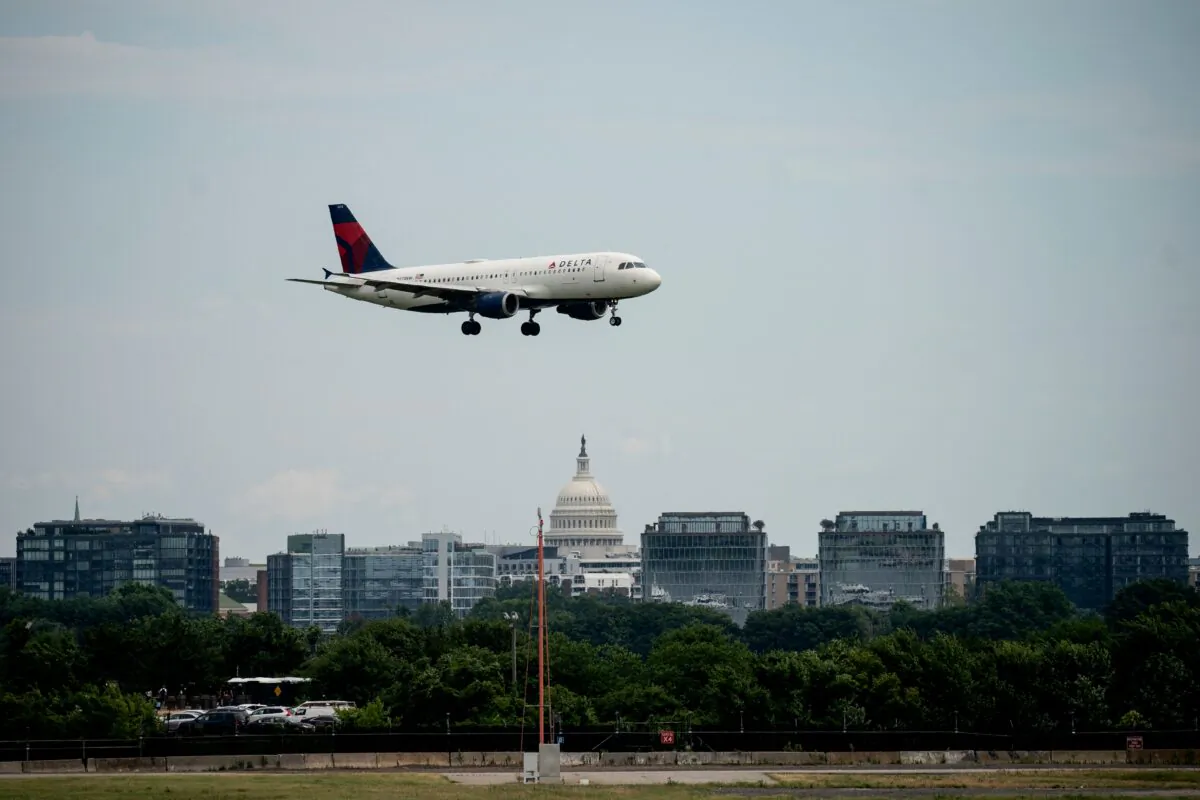 A Delta Airlines flight, with the US Capitol in the background, approaches to land at Ronald Reagan Washington National Airport in Arlington, Virginia, on July 2, 2022. (Stefani Reynolds/AFP via Getty Images)