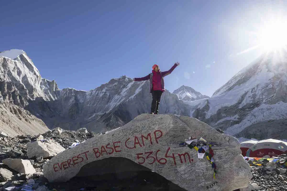 Hong Kong photographer and writer Celia standing atop the historical Everest Base Camp, Nepal. (Courtesy of Celia Cheng)