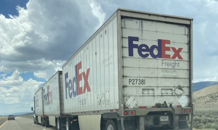 A FedEx truck hauling three trailers was a common sight on the Interstate 15 in Utah, on June 29, 2022. (Allan Stein/The Epoch Times)