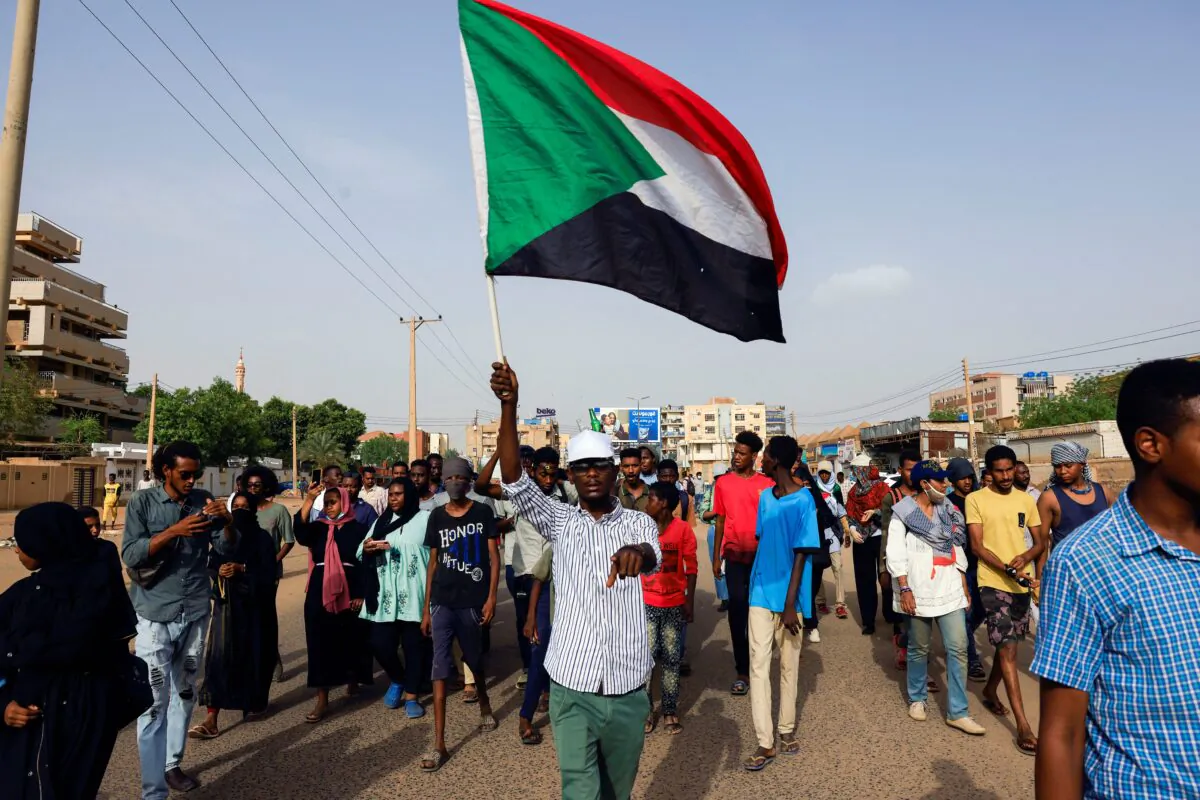 Protesters march during a rally against military rule, following the last coup and to commemorate the 3rd anniversary of demonstrations in Khartoum North, Sudan, on July 1, 2022. (Mohamed Nureldin Abdallah/Reuters)