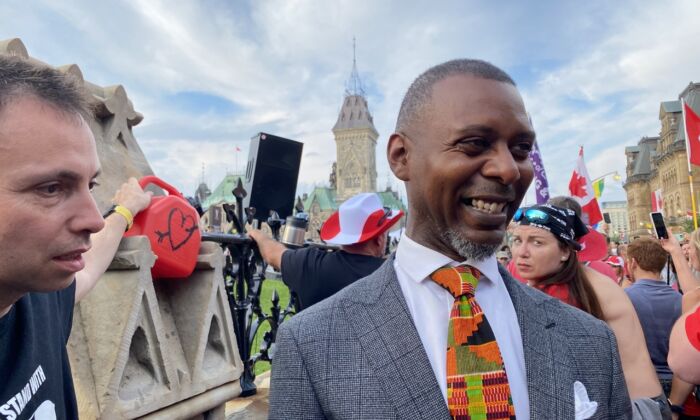 Criminal lawyer Knia Singh (R) on Parliament Hill after giving a speech to a crowd of people protesting against federal COVID-19 vaccine mandates and marking Canada Day on July 1, 2022. (Limin Zhou/The Epoch Times) 