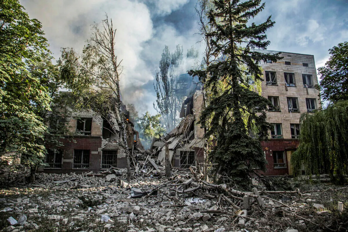 Smoke rises over the remains of a building destroyed by a military strike, as Russia's attack on Ukraine continues, in Lysychansk, Luhansk region, Ukraine, on June 17, 2022.  (Oleksandr Ratushniak/Reuters)