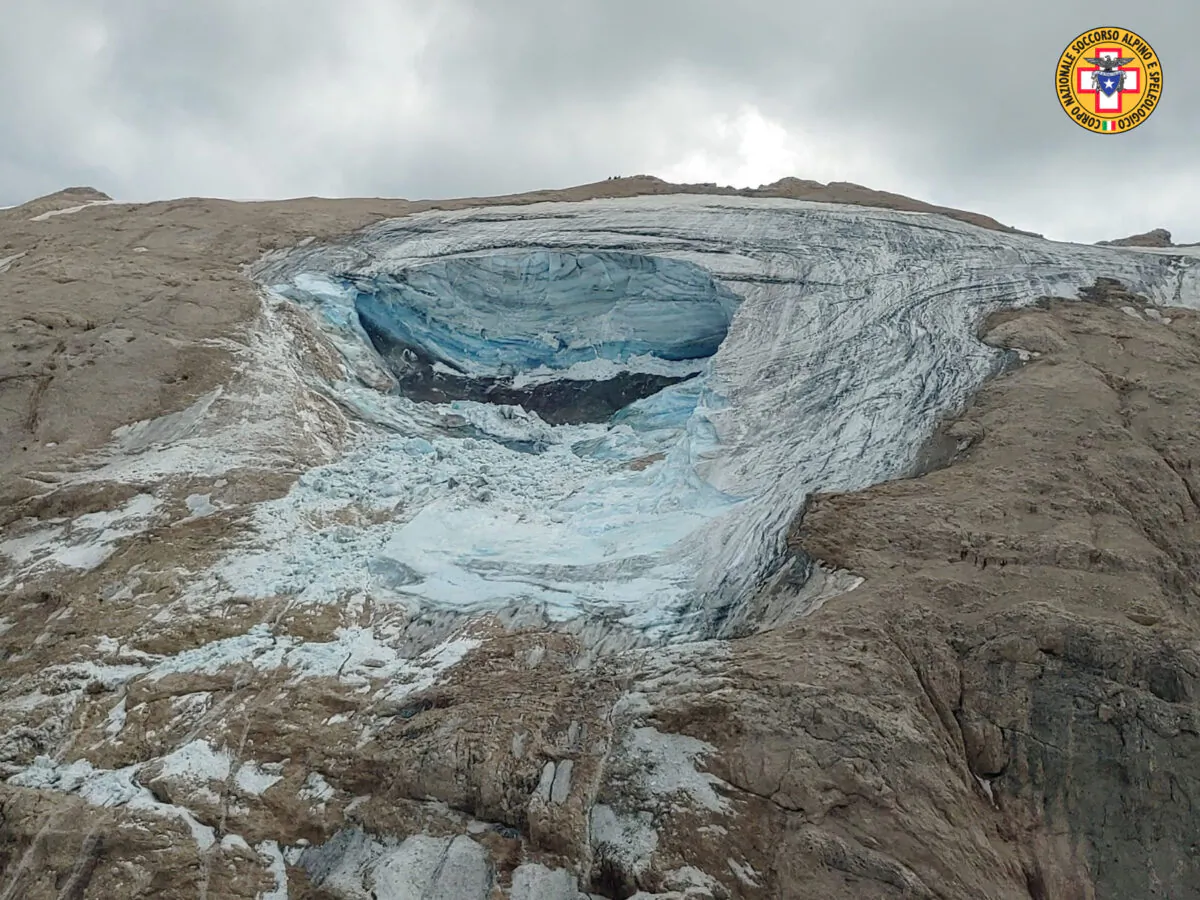 A glacier, a large chunk of which has broken loose, in Italy's Alps near Trento in an image released on July 3, 2022. (Corpo Nazionale Soccorso Alpino e Speleologico via AP)