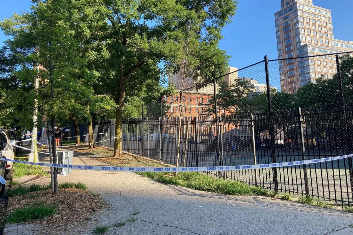 Police tape on New York's Upper East Side on June 30, 2022, where police say a 20-year-old woman was fatally shot Wednesday night while she pushed her infant daughter in a stroller. (Jennifer Peltz/AP Photo)