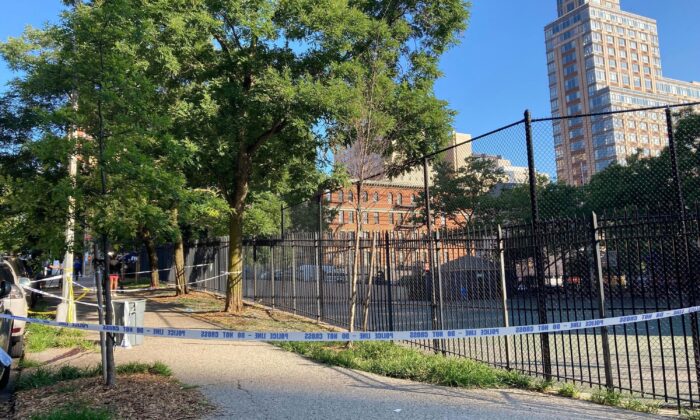 Police tape on New York's Upper East Side on June 30, 2022, where police say a 20-year-old woman was fatally shot Wednesday night while she pushed her infant daughter in a stroller. (Jennifer Peltz/AP Photo)
