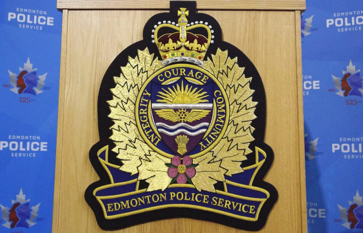 An Edmonton Police Service logo is shown on a lectern at a press conference in Edmonton, Oct. 2, 2017. (The Canadian Press/Jason Franson)
