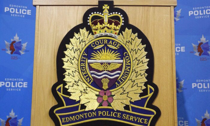 An Edmonton Police Service logo is shown on a lectern at a press conference in Edmonton, Oct. 2, 2017. (The Canadian Press/Jason Franson)