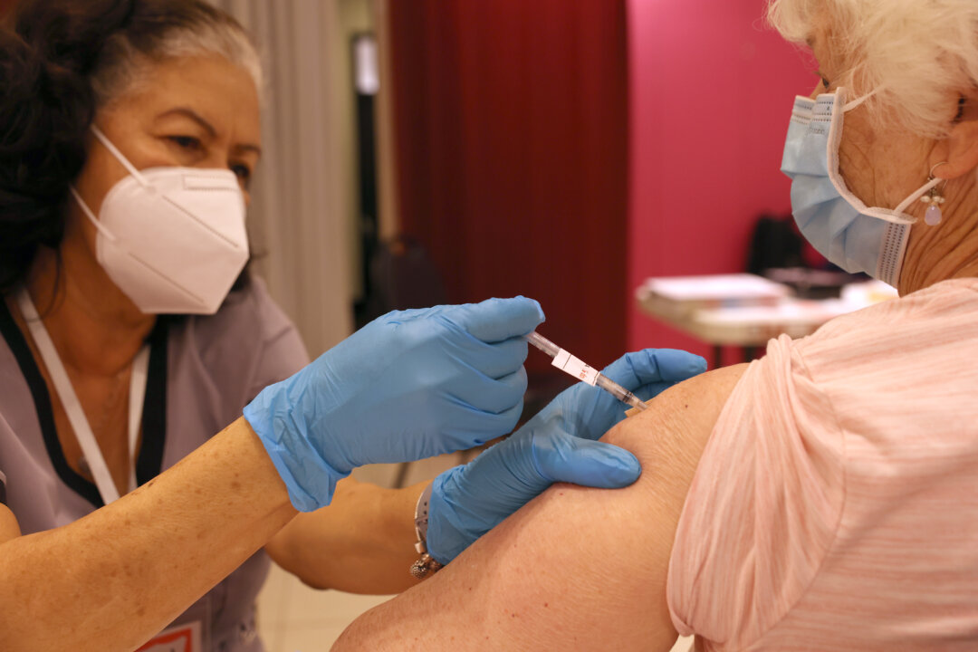 A nurse administers a COVID-19 booster vaccination at a COVID-19 vaccination clinic in San Rafael, Calif., on April 6, 2022. (Justin Sullivan/Getty Images)