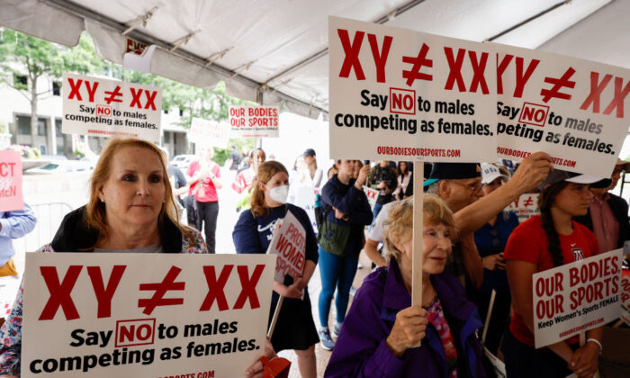 Demonstrators listen during an "Our Bodies, Our Sports" rally for the 50th anniversary of Title IX at Freedom Plaza in Washington, on June 23, 2022. (Anna Moneymaker/Getty Images)