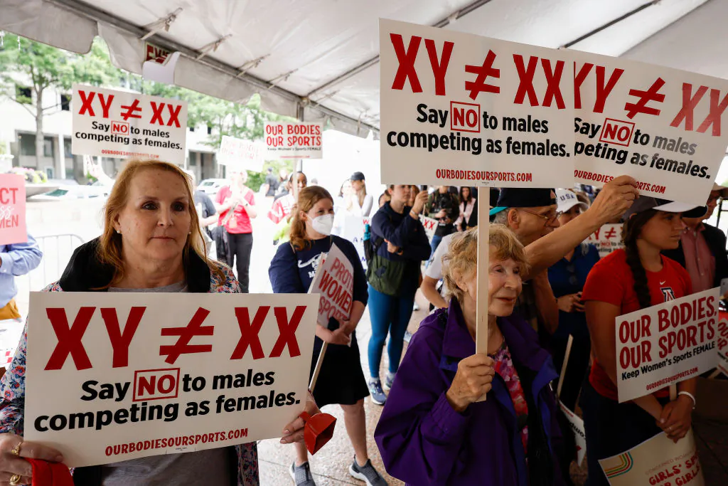 Demonstrators listen to the speaking program during an "Our Bodies, Our Sports" rally for the 50th anniversary of Title IX at Freedom Plaza in Washington, on June 23, 2022. (Anna Moneymaker/Getty Images)