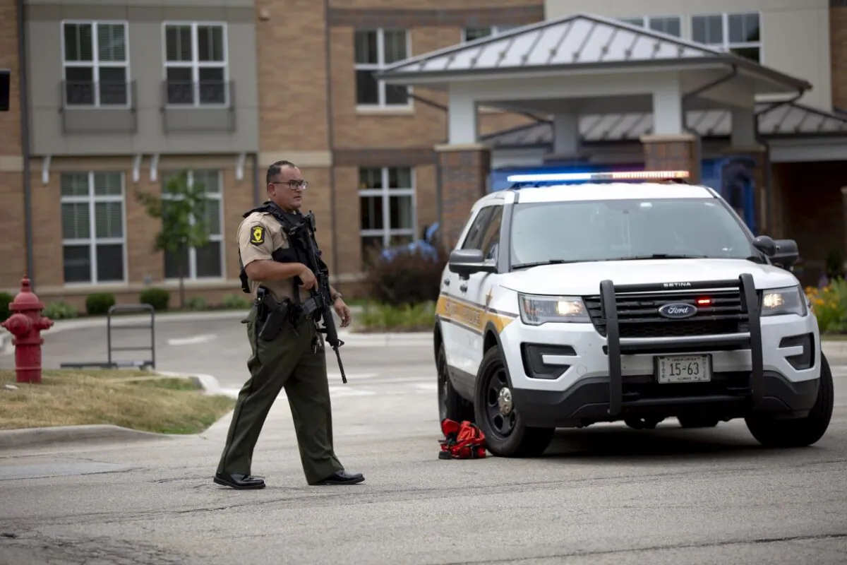 First responders work the scene of a shooting at a Fourth of July parade in Highland Park, Ill., on July 4, 2022. (Jim Vondruska/Getty Images)