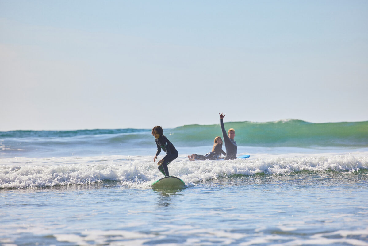 A family learns to surf at The Seabird Resort in Oceanside, California. (Photo courtesy of The Seabird Resort.)