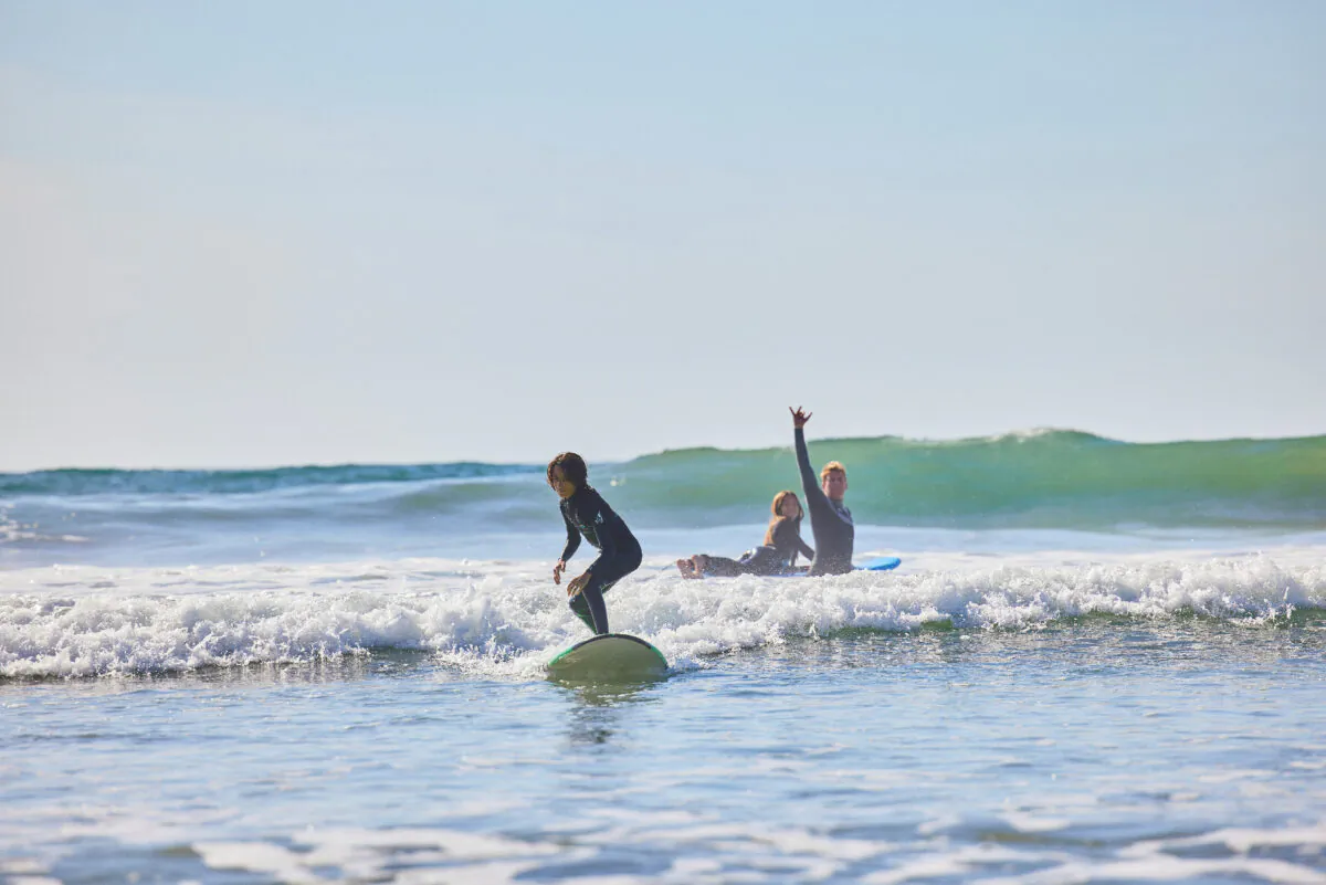 A family learns to surf at The Seabird Resort in Oceanside, California. (Photo courtesy of The Seabird Resort)
