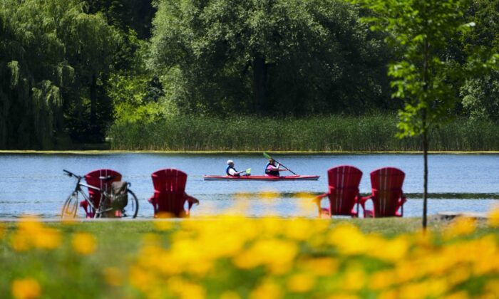 People enjoy summer weather in Ottawa on July 4, 2022. (The Canadian Press/Sean Kilpatrick)