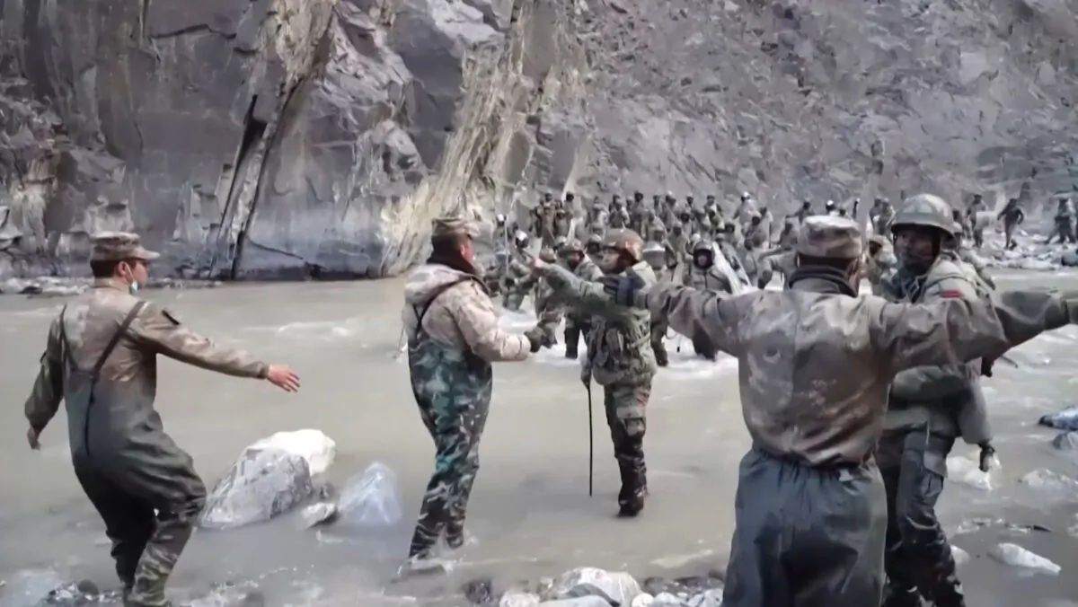 This video frame grab taken from footage recorded in mid-June 2020 and released by China Central Television (CCTV) on Feb. 20, 2021, shows Chinese (foreground) and Indian soldiers (R, background) during an incident where troops from both countries clashed in the Line of Actual Control (LAC) in the Galwan Valley, in the Karakoram Mountains in the Himalayas. The two sides again clashed on Dec. 9, 2022, in Tawang sector of Arunachal Pradesh leading to injuries. (AFP Photo/China Central Television)