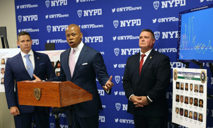 New York Mayor Eric Adams is joined by NYPD Deputy Chief Jason Savino (left) and NYPD Chief of Detectives James Essig at a Brooklyn police facility where it was announced that arrests have been made against violent street gangs in New York City, on June 6, 2022. (Spencer Platt/Getty Images)