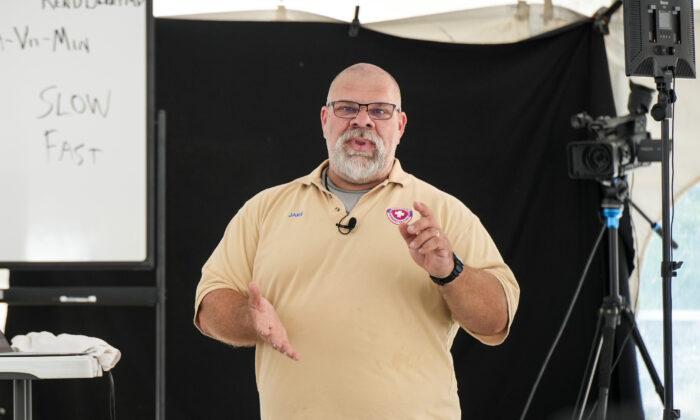 Former paramedic Jake Drumm talks about medical care in austere environments at a Self Reliance Festival in Camden, Tenn., on June 11, 2022. (Charlotte Cuthbertson/The Epoch Times)