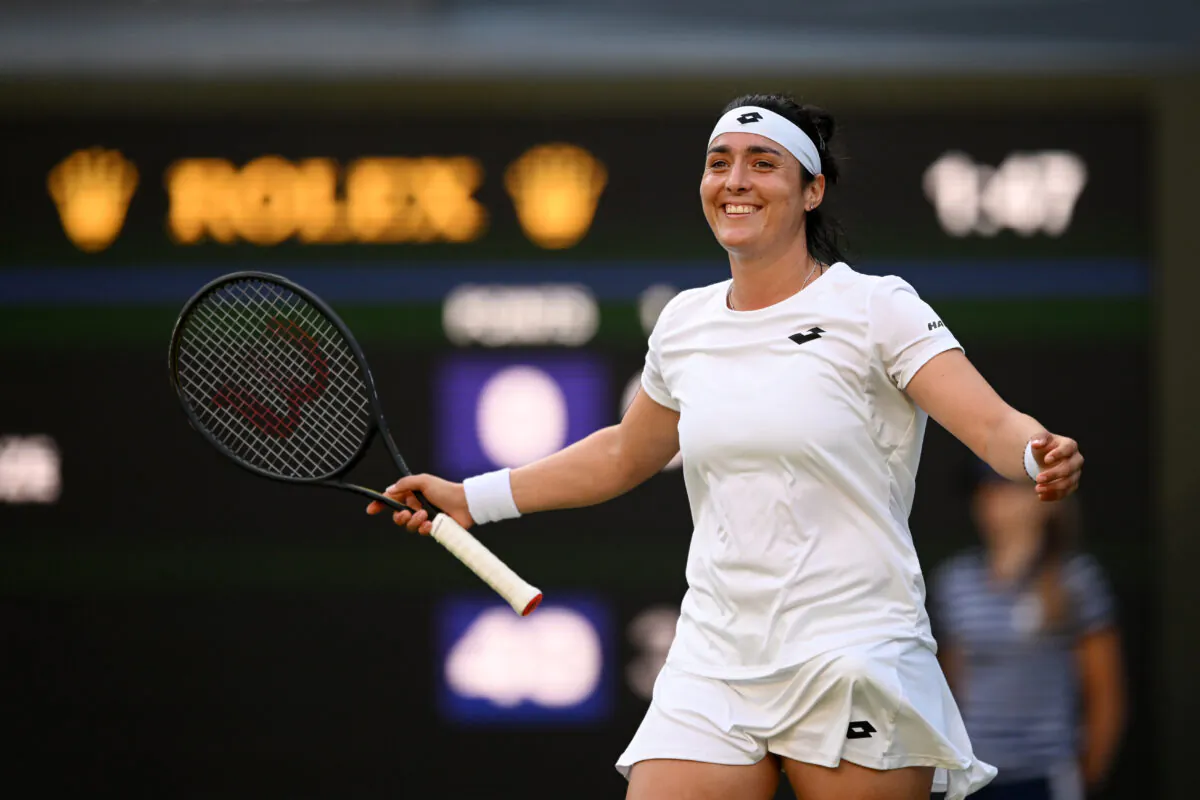 Ons Jabeur of Tunisia celebrates after winning match point against Marie Bouzkova of Czech Republic during their Women's Singles Quarter Final match on day nine of The Championships Wimbledon 2022 at All England Lawn Tennis and Croquet Club in London on July 5, 2022. (Shaun Botterill/Getty Images)