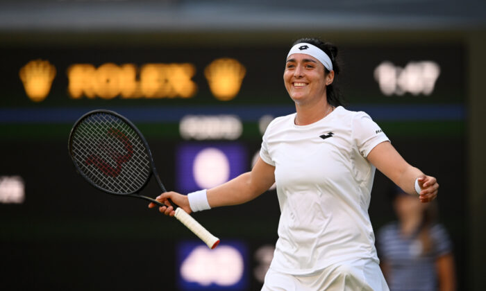 Ons Jabeur of Tunisia celebrates after winning match point against Marie Bouzkova of Czech Republic during their Women's Singles Quarter Final match on day nine of The Championships Wimbledon 2022 at All England Lawn Tennis and Croquet Club in London on July 5, 2022. (Shaun Botterill/Getty Images)