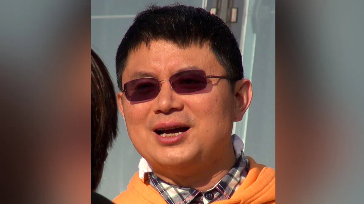 Xiao Jianhua, a Chinese-born Canadian billionaire, talks to reporters outside the International Finance Centre in Hong Kong in December 2013. (Next Magazine via AP)