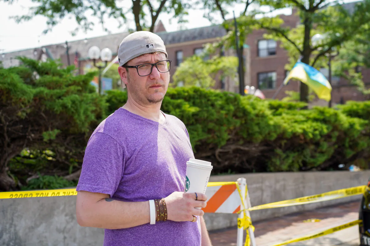 Morgan Moss stands in downtown Highland Park, Ill., on July 5, 2022. (Cara Ding/The Epoch Times)