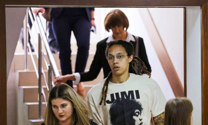 U.S. basketball player Brittney Griner, who was detained in March at Moscow's Sheremetyevo airport and later charged with illegal possession of cannabis, is escorted before a court hearing in Khimki outside Moscow on July 1, 2022. (Evgenia Novozhenina/Reuters)