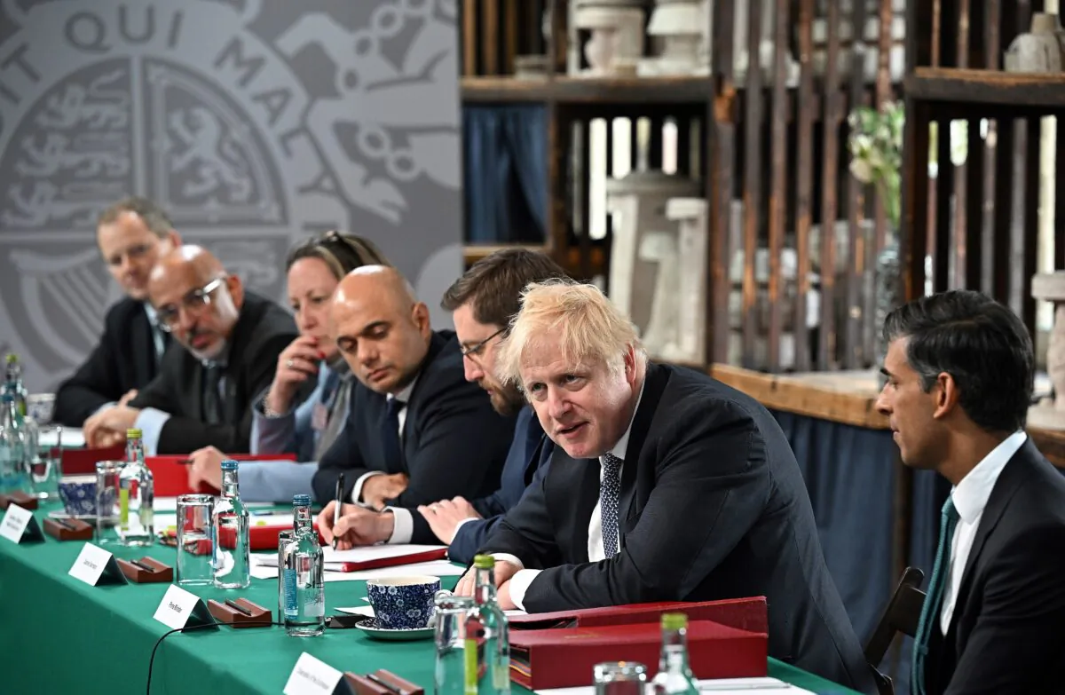 (2nd L-R) Education Secretary Nadhim Zahawi, International Trade Secretary Anne-Marie Trevelyan, Health Secretary Sajid Javid, Cabinet Secretary Simon Case, Prime Minister Boris Johnson, and Chancellor of the Exchequer Rishi Sunak during a regional cabinet meeting at Middleport Pottery in Stoke on Trent on May 12, 2022. (Oli Scarff/PA Media)