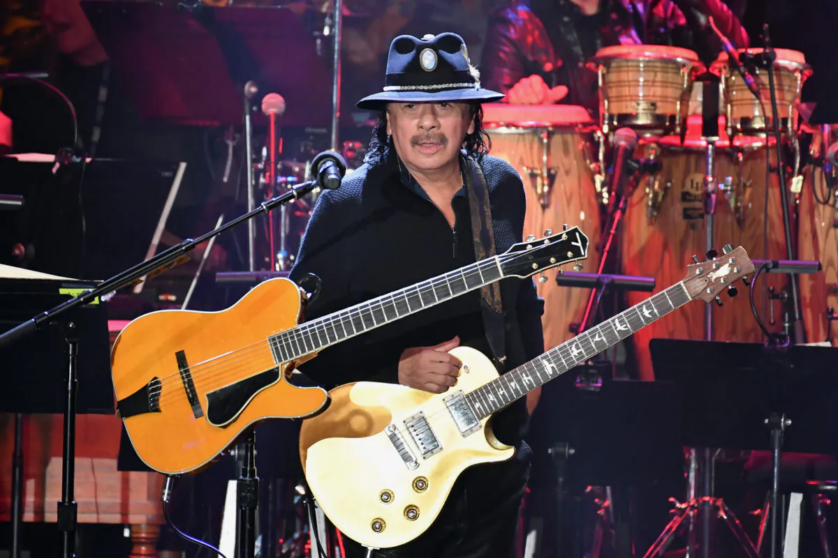 Carlos Santana performs onstage during the Pre-GRAMMY Gala and GRAMMY Salute to Industry Icons Honoring Sean "Diddy" Combs in Beverly Hills, Calif., on Jan. 25, 2020. (Allen Berezovsky/Getty Images)