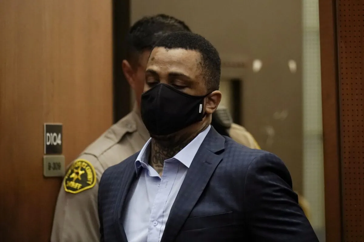 Eric Holder Jr., who is accused of killing rapper Nipsey Hussle, enters a courtroom to hear the verdicts in his murder trial at Los Angeles Superior Court in Los Angeles on July 6, 2022. (Jae C. Hong/Pool via AP)