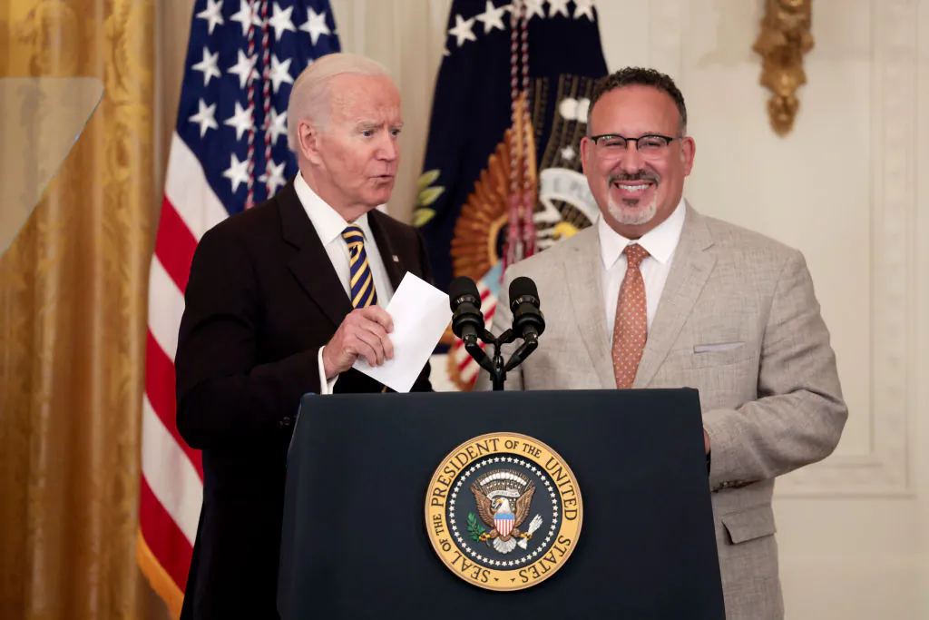 President Joe Biden (L) and Education Secretary Miguel Cardona deliver remarks during an event for the 2022 National and State Teachers of the Year at the White House on Apr. 27, 2022. (Anna Moneymaker/Getty Images)