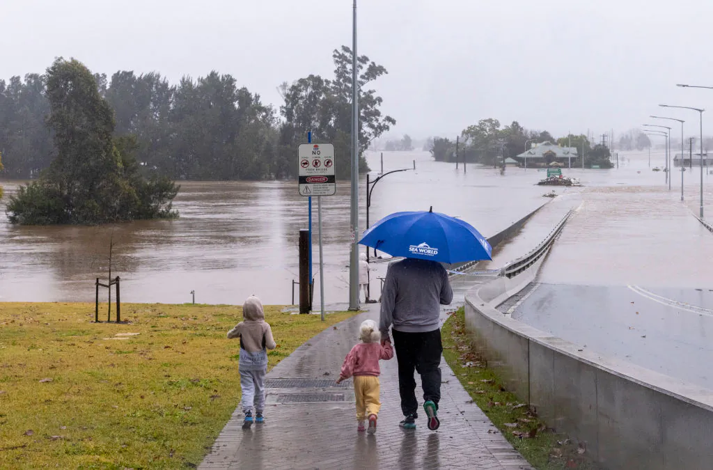 People view the flooded Windsor Bridge along the Hawkesbury River in the suburb of Windsor in Sydney, Australia, on July 4, 2022. (Jenny Evans/Getty Images)