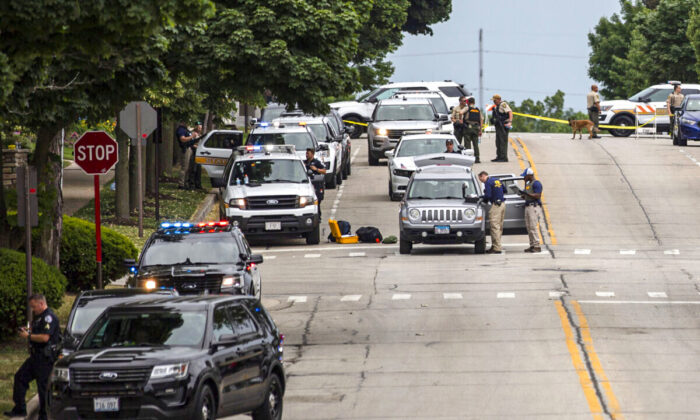 Law enforcement works the scene after a mass shooting at a Fourth of July parade in Highland Park, Ill., on July 4, 2022. (Jim Vondruska/Getty Images)