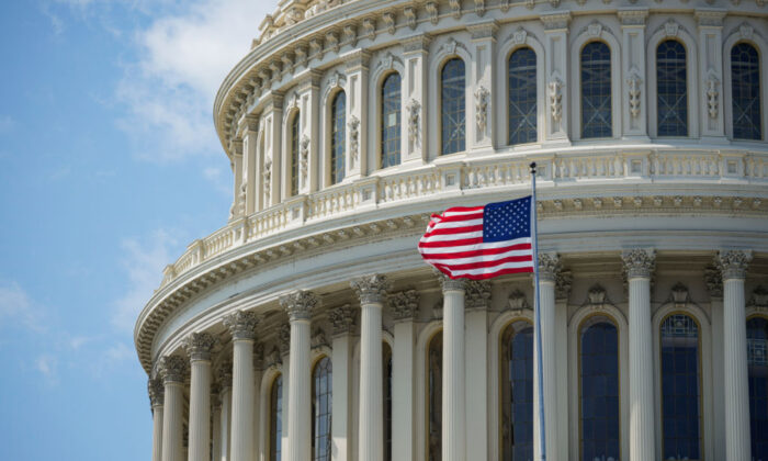 The American flag flies in front of the U.S. Capitol dome in Washington on Sept. 10, 2021. (Drew Angerer/Getty Images)