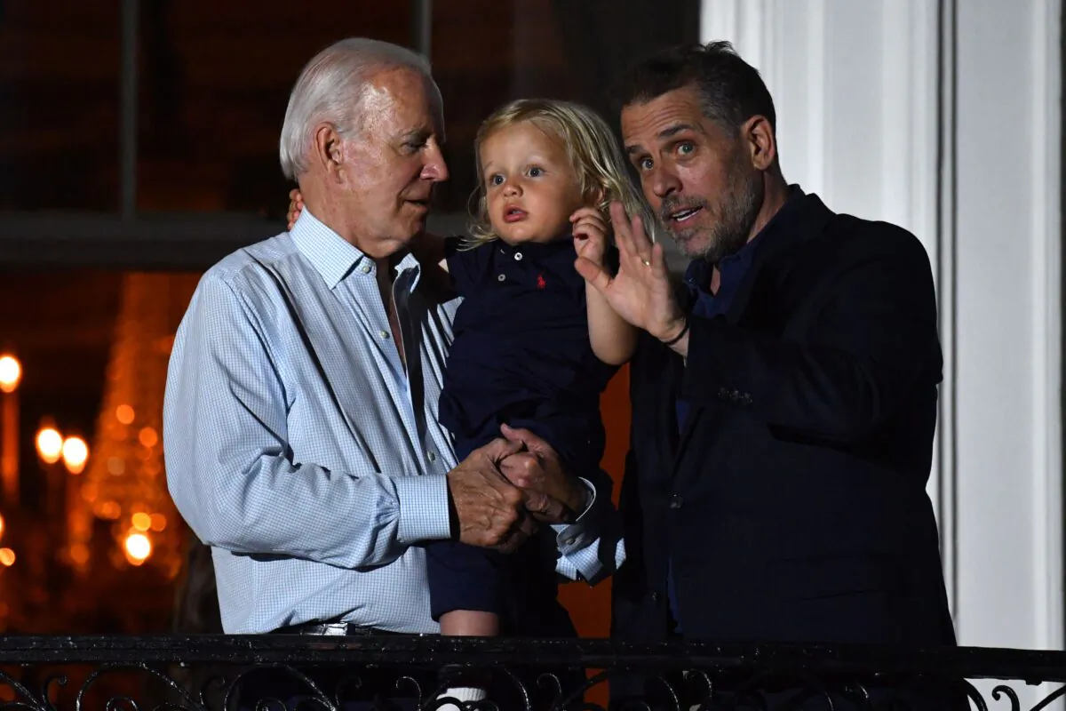 President Joe Biden (L) and son Hunter Biden (R) on a balcony of the White House to watch 4th of July fireworks in Washington on July 4, 2022. (Nicholas Kamm/AFP via Getty Images)