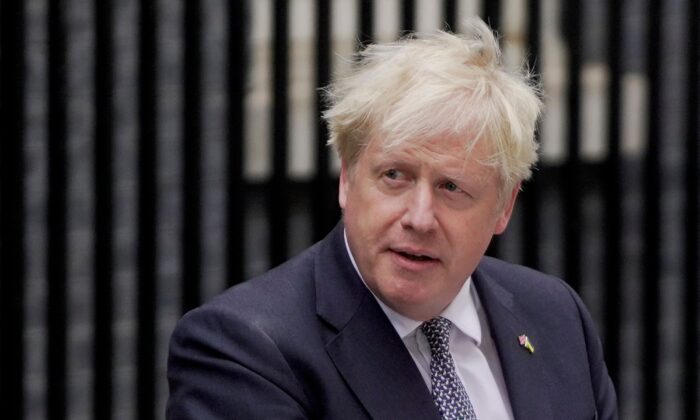 Britain's Prime Minister Boris Johnson makes a resignation statement in front of 10 Downing Street in central London on July 7, 2022. (Niklas Halle'n/AFP via Getty Images)