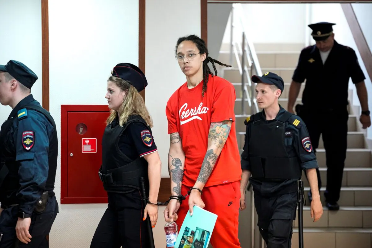 WNBA star and two-time Olympic gold medalist Brittney Griner is escorted to a courtroom for a hearing, in Khimki just outside Moscow, Russia, on July 7, 2022. (Alexander Zemlianichenko/AP Photo)