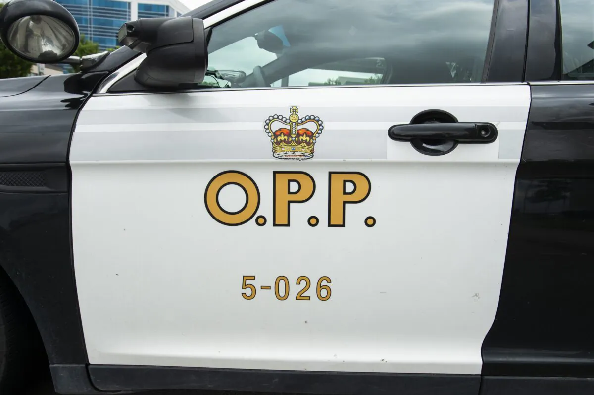 An Ontario Provincial Police cruiser sits outside of a press conference in Vaughan, Ont., on June 20, 2019. (The Canadian Press/Andrew Lahodynskyj)