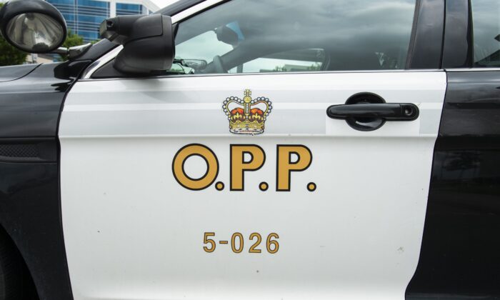 An Ontario Provincial Police cruiser sits outside of a press conference in Vaughan, Ont., on June 20, 2019. (The Canadian Press/Andrew Lahodynskyj)