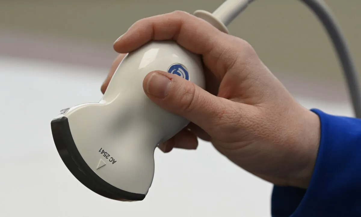 Portico Crisis Pregnancy Center nurse Cassie Owen holds an ultrasound abdominal probe Jan. 26, 2022, in Murfreesboro, Tenn. (Mark Zaleski/AP)