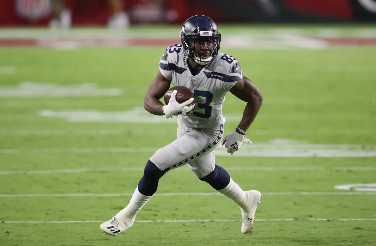 Wide receiver David Moore (83) of the Seattle Seahawks runs with the football after a reception against the Arizona Cardinals during the NFL game at State Farm Stadium in Glendale, Ariz., on Oct. 25, 2020. (Christian Petersen/Getty Images)