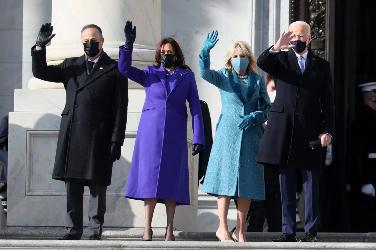(L-R) Doug Emhoff, Vice President-elect Kamala Harris, Jill Biden, and President-elect Joe Biden wave as they arrive on the East Front of the U.S. Capitol for the inauguration in Washington on Jan. 20, 2021. (Joe Raedle/Getty Images)
